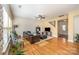 Bright living room with hardwood floors, large windows, and a comfortable sofa at 9018 Seamill Rd, Charlotte, NC 28278
