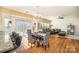 Open dining/living space with hardwood floors, modern furnishings, and natural light at 9018 Seamill Rd, Charlotte, NC 28278