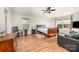 Primary bedroom with wood floors, multiple windows, and seating area at 9018 Seamill Rd, Charlotte, NC 28278