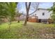 Picture of an open backyard, complemented by a wooden deck and lush green space at 98 Ring Sw Ave, Concord, NC 28025