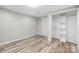 Bedroom with spacious closet, fresh paint, new flooring, and natural light at 98 Ring Sw Ave, Concord, NC 28025