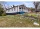 Quaint home with a welcoming porch, and a flower-filled yard creating charming curb appeal at 98 Ring Sw Ave, Concord, NC 28025