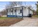 Charming renovated home features a welcoming front porch, and a freshly landscaped yard at 98 Ring Sw Ave, Concord, NC 28025