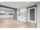 Bright open floor plan showcasing the beautifully remodeled kitchen with stainless appliances at 98 Ring Sw Ave, Concord, NC 28025