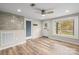 Bright living area boasts natural light, modern ceiling fan, new wood flooring and accent tile at 98 Ring Sw Ave, Concord, NC 28025