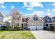 Charming two-story home with a well-manicured lawn and a two-car garage at 10153 Elizabeth Crest Ln, Charlotte, NC 28277