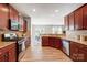 Spacious kitchen with stainless steel appliances and seamless connection to dining area at 10153 Elizabeth Crest Ln, Charlotte, NC 28277