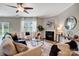 Cozy living room with a fireplace, plush seating, and modern decor, creating a comfortable space at 10153 Elizabeth Crest Ln, Charlotte, NC 28277