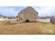 Wide backyard featuring a concrete patio and privacy fence, creating a private outdoor retreat at 10605 Three Rivers Ct, Charlotte, NC 28273