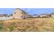 Expansive backyard with potential, featuring a concrete patio extending from the house at 10605 Three Rivers Ct, Charlotte, NC 28273