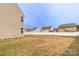 View of a spacious backyard, showcasing its potential for outdoor activities and landscaping opportunities at 10605 Three Rivers Ct, Charlotte, NC 28273