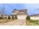 Inviting two-story home with a two car garage, well-maintained lawn, and a welcoming porch at 10605 Three Rivers Ct, Charlotte, NC 28273