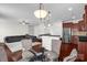 Open floor plan connects living room with modern kitchen and stainless appliances at 10605 Three Rivers Ct, Charlotte, NC 28273