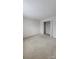 Cozy bedroom with carpet flooring and closet, perfect for restful nights and organization at 10607 Old Bridge Ln, Charlotte, NC 28269