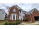Charming brick two-story home with landscaped yard at 10607 Old Bridge Ln, Charlotte, NC 28269