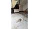 Interior of a two-car garage showing bare studs, brick foundation, and concrete floor at 10607 Old Bridge Ln, Charlotte, NC 28269