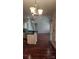 A view from the living room into the kitchen with stainless sink and island at 10607 Old Bridge Ln, Charlotte, NC 28269