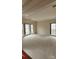 Spacious living room with plush carpeting and plenty of natural light from large windows at 10607 Old Bridge Ln, Charlotte, NC 28269
