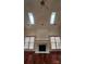Bright Living Room with a Fireplace, and skylights at 10607 Old Bridge Ln, Charlotte, NC 28269