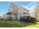 The backyard of the home has a deck and lots of shade from the surrounding trees at 10820 Hunters Trace Ct, Charlotte, NC 28262