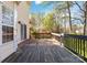Wooden deck area provides an outdoor living space with forest in the background at 10820 Hunters Trace Ct, Charlotte, NC 28262