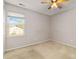 A cozy bedroom featuring a ceiling fan and window at 10820 Hunters Trace Ct, Charlotte, NC 28262