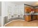 Bright dining area with large windows near kitchen featuring wood cabinets at 10820 Hunters Trace Ct, Charlotte, NC 28262