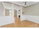 Open-concept living area featuring hardwood floors, a fireplace, and access to other rooms at 10820 Hunters Trace Ct, Charlotte, NC 28262