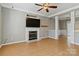 Inviting living room features a marble fireplace and seamless flow into the dining area at 10820 Hunters Trace Ct, Charlotte, NC 28262
