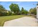 A sprawling backyard featuring a lush lawn, shade trees, and ample space for outdoor activities at 10933 Sedgemoor E Ln, Charlotte, NC 28277