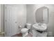 Powder bathroom with sink and toilet at 10933 Sedgemoor E Ln, Charlotte, NC 28277