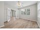 Bedroom with lots of natural light from two windows and light wood flooring at 10933 Sedgemoor E Ln, Charlotte, NC 28277