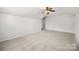 Bedroom featuring neutral carpet and a ceiling fan at 10933 Sedgemoor E Ln, Charlotte, NC 28277