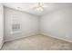 Bedroom featuring neutral carpet and a window at 10933 Sedgemoor E Ln, Charlotte, NC 28277