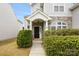Charming home featuring a stone facade, welcoming front door, and manicured landscaping at 10933 Sedgemoor E Ln, Charlotte, NC 28277