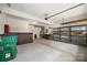 Spacious garage with ample storage shelving, workspace and room for vehicles and projects at 10933 Sedgemoor E Ln, Charlotte, NC 28277
