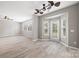Spacious living room with lots of windows providing natural light and wood flooring at 10933 Sedgemoor E Ln, Charlotte, NC 28277