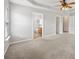 Spacious main bedroom with neutral carpet and attached bathroom at 10933 Sedgemoor E Ln, Charlotte, NC 28277