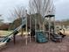 Community playground with slides, stairs, and platforms, inviting children to explore and enjoy outdoor activities at 10933 Sedgemoor E Ln, Charlotte, NC 28277