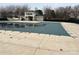 Community pool is covered during off season, and the pool house is visible in the background at 10933 Sedgemoor E Ln, Charlotte, NC 28277