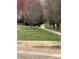 A well-maintained walking path, framed by mature trees, offering a serene and inviting space for leisurely strolls at 10933 Sedgemoor E Ln, Charlotte, NC 28277