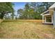 Large backyard with a newly installed wooden privacy fence and ample space for outdoor activities at 1210 Skyview Rd, Charlotte, NC 28208