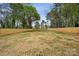 Expansive backyard enclosed by a wooden fence, providing privacy and ample space for recreation at 1210 Skyview Rd, Charlotte, NC 28208