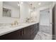 Modern bathroom with dual sinks, marble countertops, and elegant gold fixtures at 1210 Skyview Rd, Charlotte, NC 28208