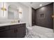 Modern bathroom with dual vanity, marble countertops, and a luxurious soaking tub with tile surround at 1210 Skyview Rd, Charlotte, NC 28208