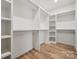 Spacious walk-in closet with ample shelving and storage for clothing and accessories, providing organization and convenience at 1210 Skyview Rd, Charlotte, NC 28208