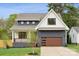 Charming two-story home with a modern farmhouse design and well-maintained landscaping at 1210 Skyview Rd, Charlotte, NC 28208