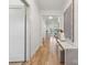 Bright hallway featuring hardwood floors and a view to the living room at 1210 Skyview Rd, Charlotte, NC 28208