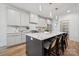 Modern kitchen island featuring marble countertops and pendant lighting at 1210 Skyview Rd, Charlotte, NC 28208