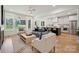 Bright, open living room featuring a modern color palette and hardwood floors at 1210 Skyview Rd, Charlotte, NC 28208